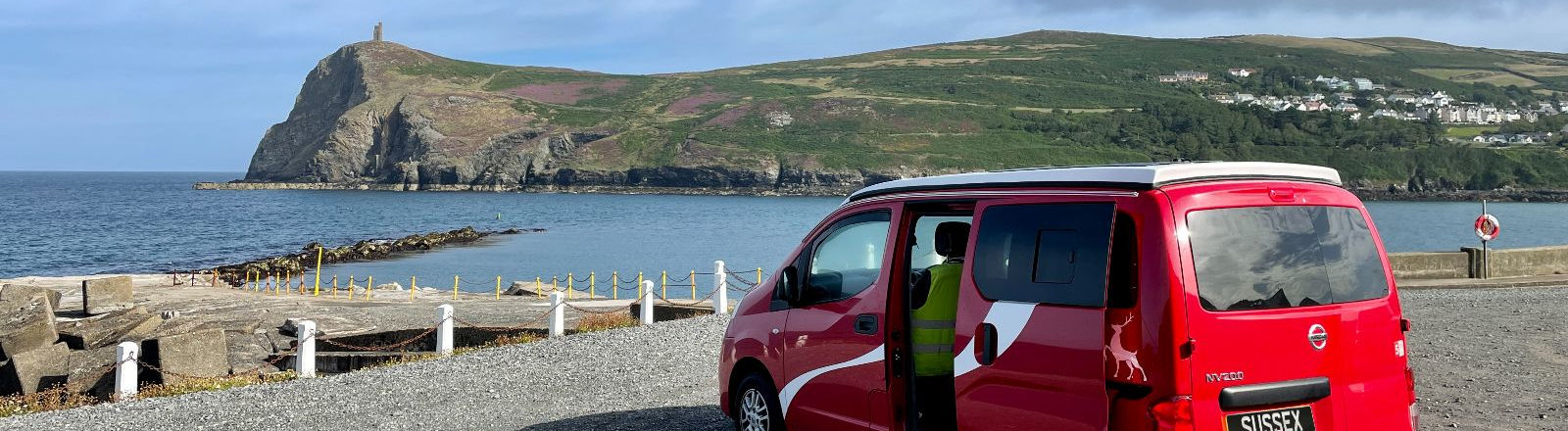 red campervan parked in Isle of Man