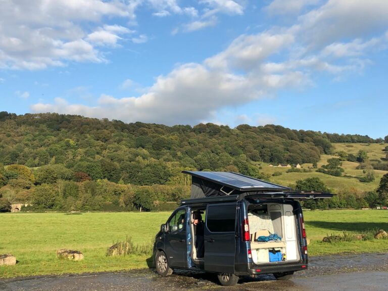 black campervan with nature background