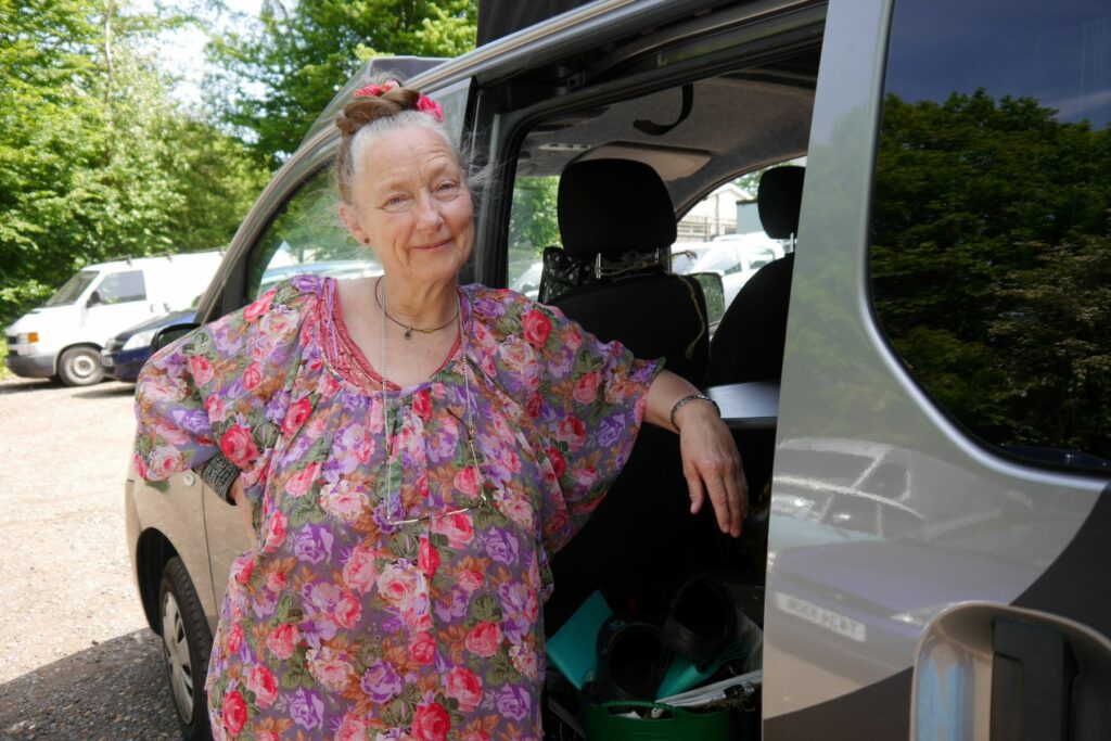 Ruth beside her campervan