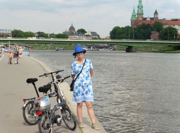 Hong cycling along the river in Krakow