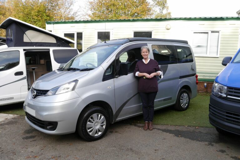 Nicola with her silver campervan