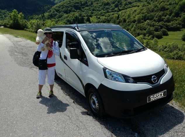 Hong with her white campervan