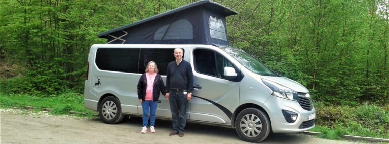 Tony and Patsy beside their campervan in in New Forest