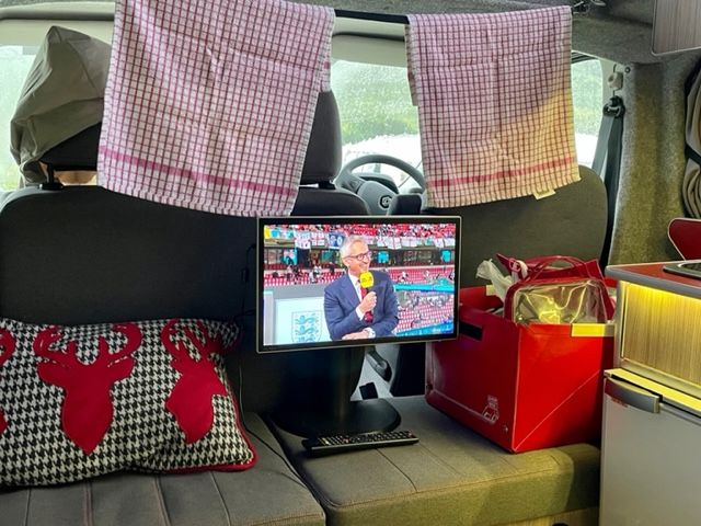 watching tv inside campervan